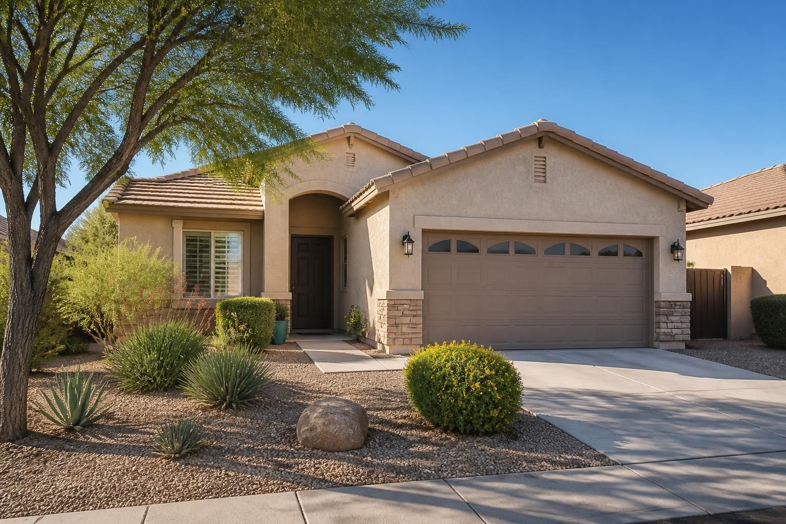 Suburban home exterior with desert-style landscaping in Goodyear.