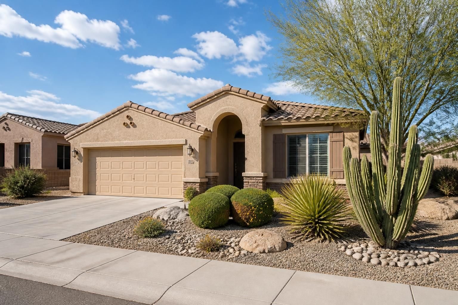 Clean suburban home with desert plants and open bright skies in Surprise.